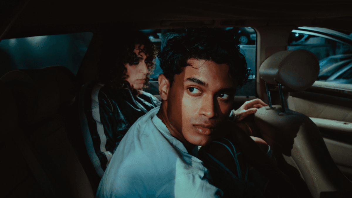 Two people in the back seat of a car
