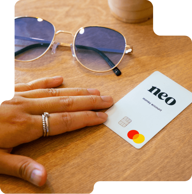 Person tapping Neo Financial card for payment