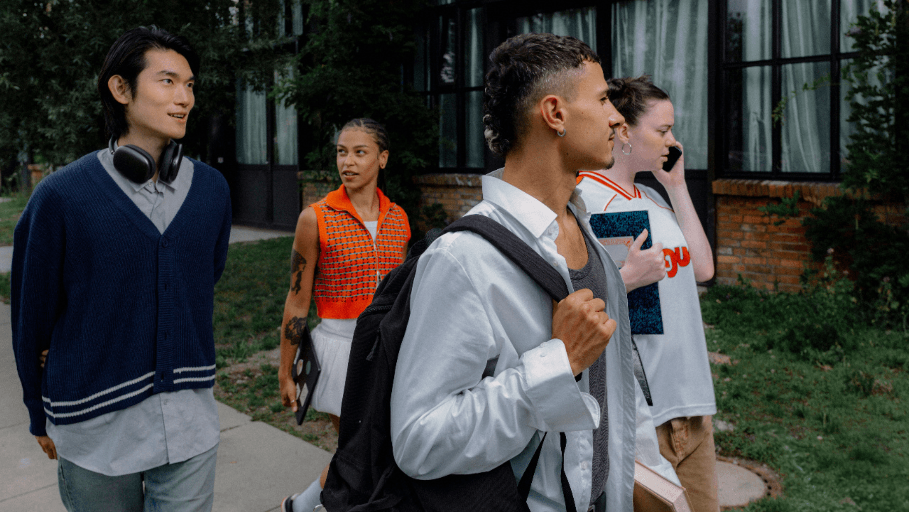 A group of students walking to class on campus, sharing budgeting tips for students in Canada
